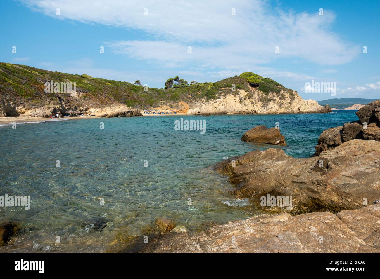 SKIATHOS, GREECE - 14-22-2022 - Krifi Ammos beach, one of the most beautiful in Skiathos, with rich vegetation and turquoise sea. Stock Photo