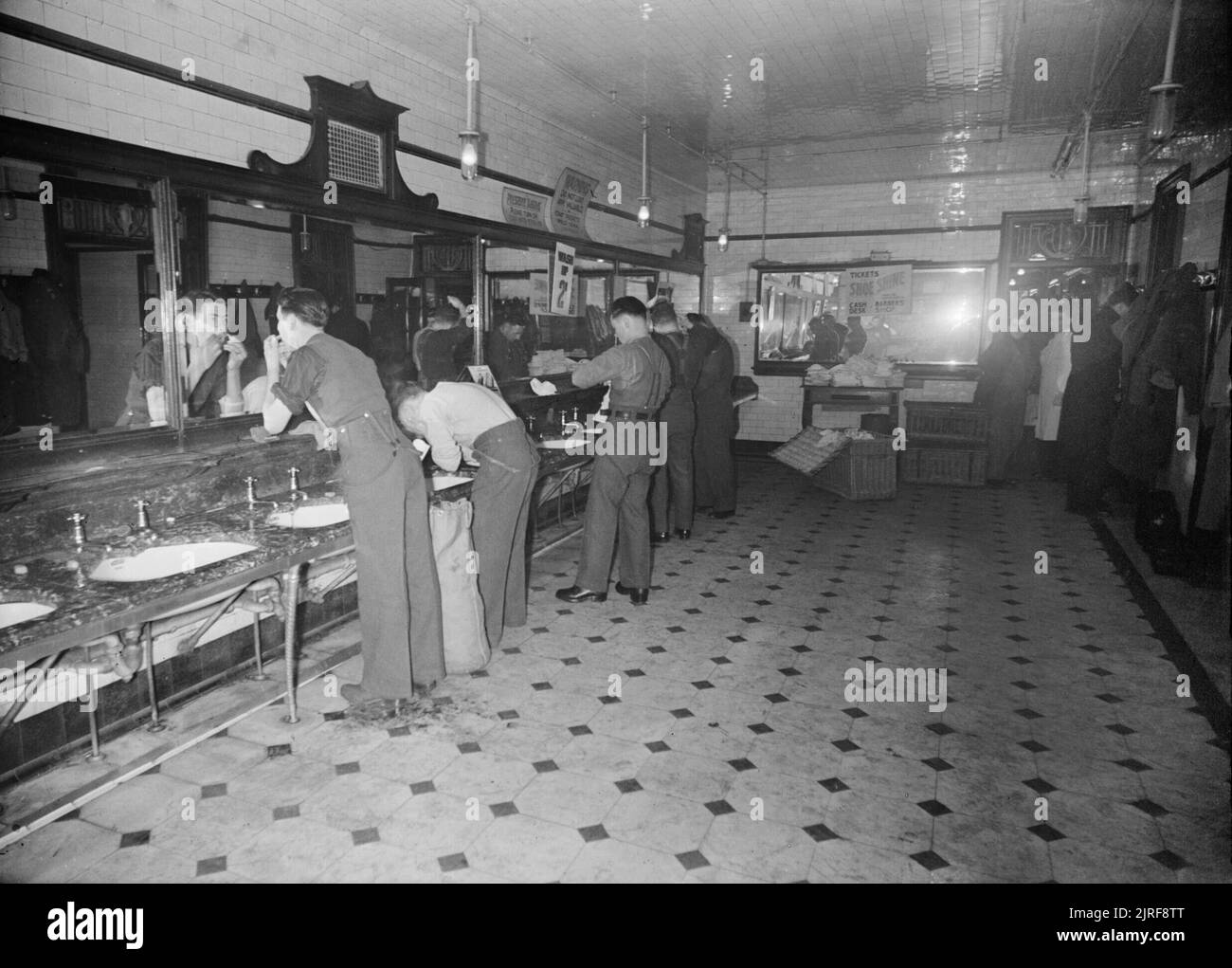 In the washrooms at Glasgow Central Station, soldiers just off the