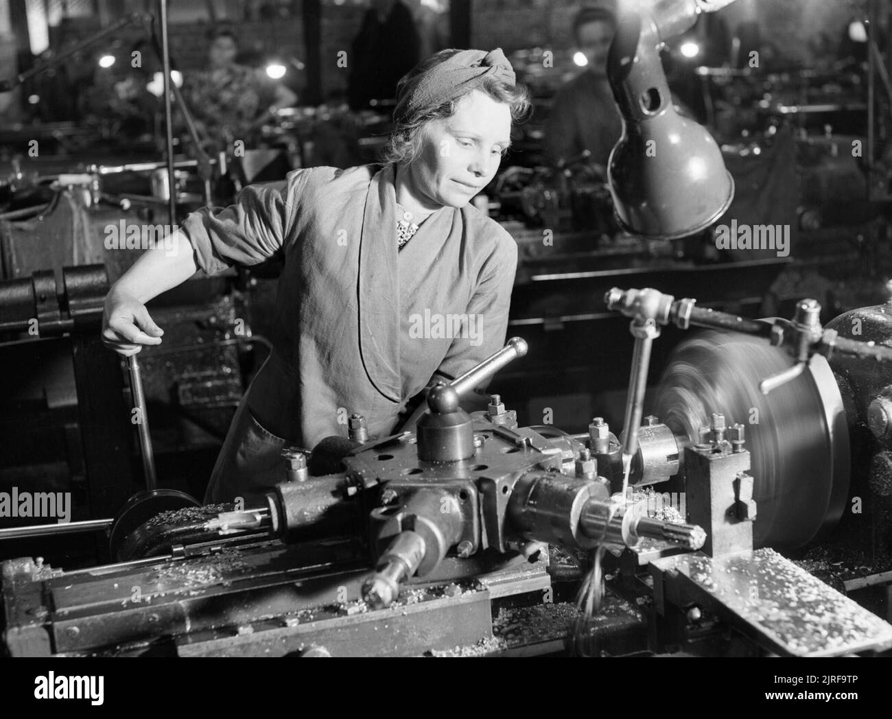 Mrs D Cheatle from Sheffield operating a capstan lathe at a munitions