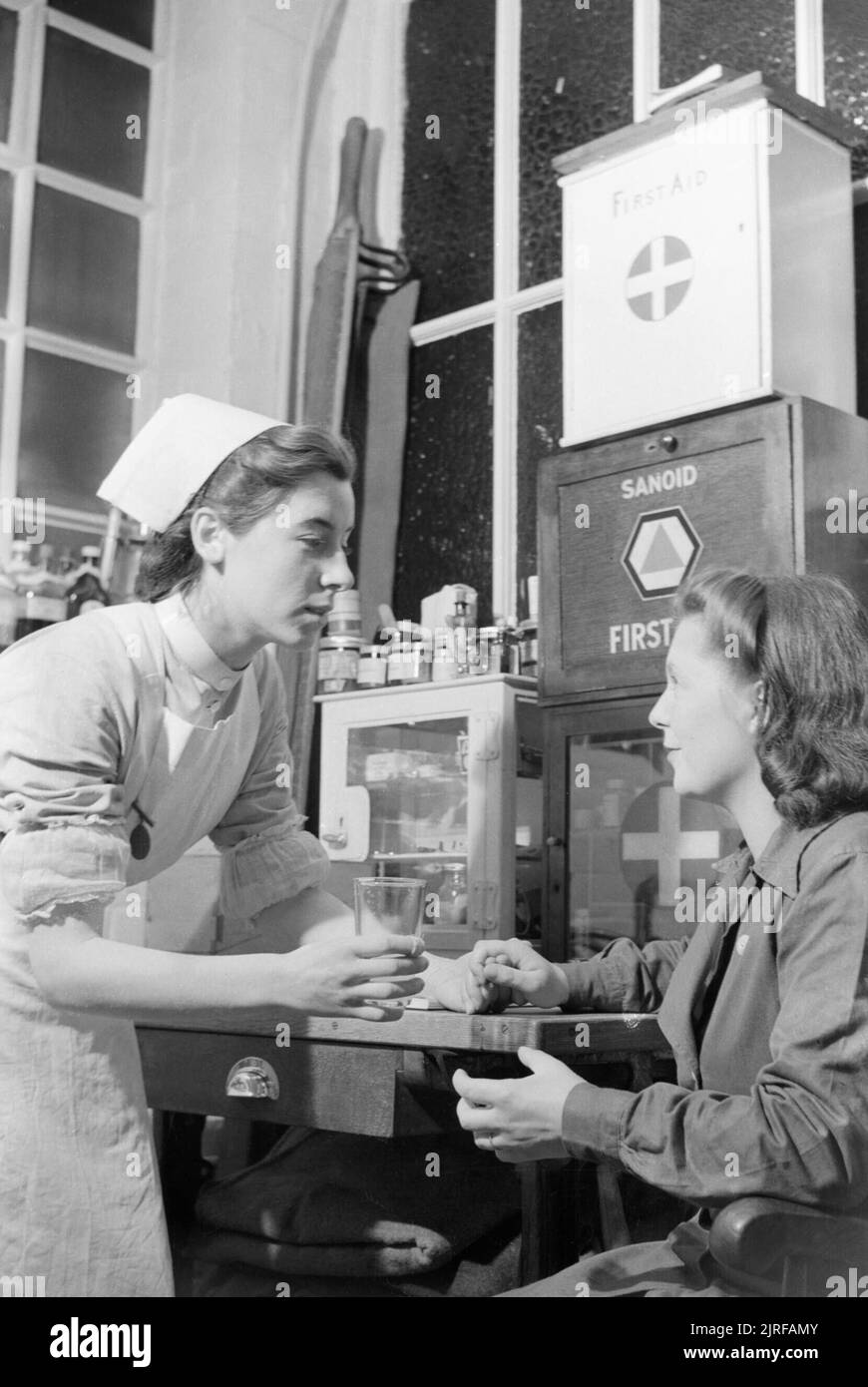 Pregnant wartime worker Irene Stacey visits the nurse in a clinic ...