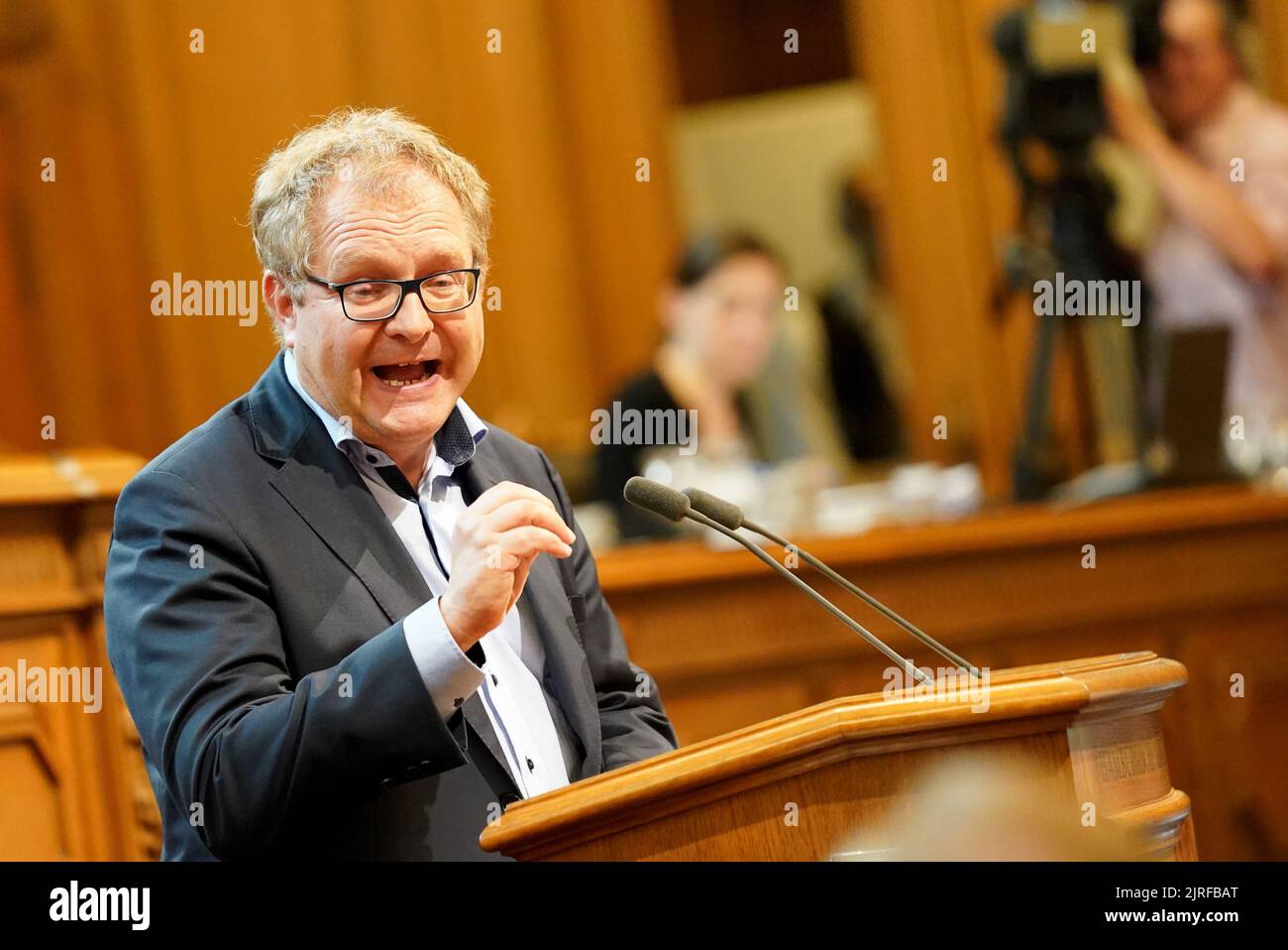 Hamburg, Germany. 24th Aug, 2022. Jens Kerstan (Bündnis 90/Die Grünen), Senator for Environment, Climate, Energy and Agriculture in Hamburg, speaks during the session of the Hamburg Parliament at City Hall. Credit: Marcus Brandt/dpa/Alamy Live News Stock Photo