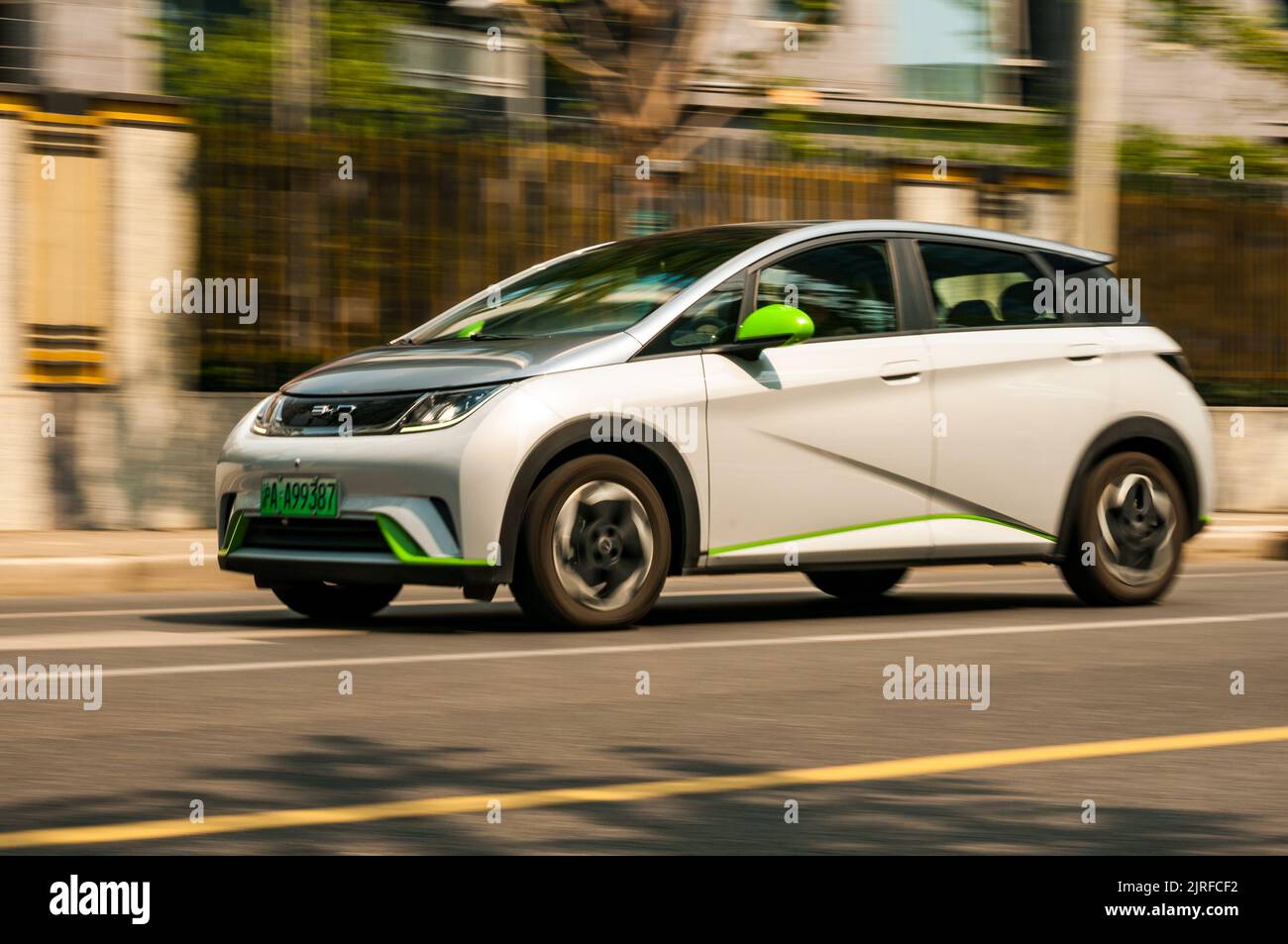 BYD Dolphin small electric hatchback car being driven on the road in