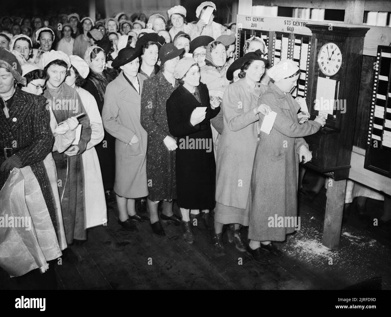 War Workers Clock in at a British Factory A large group of female war