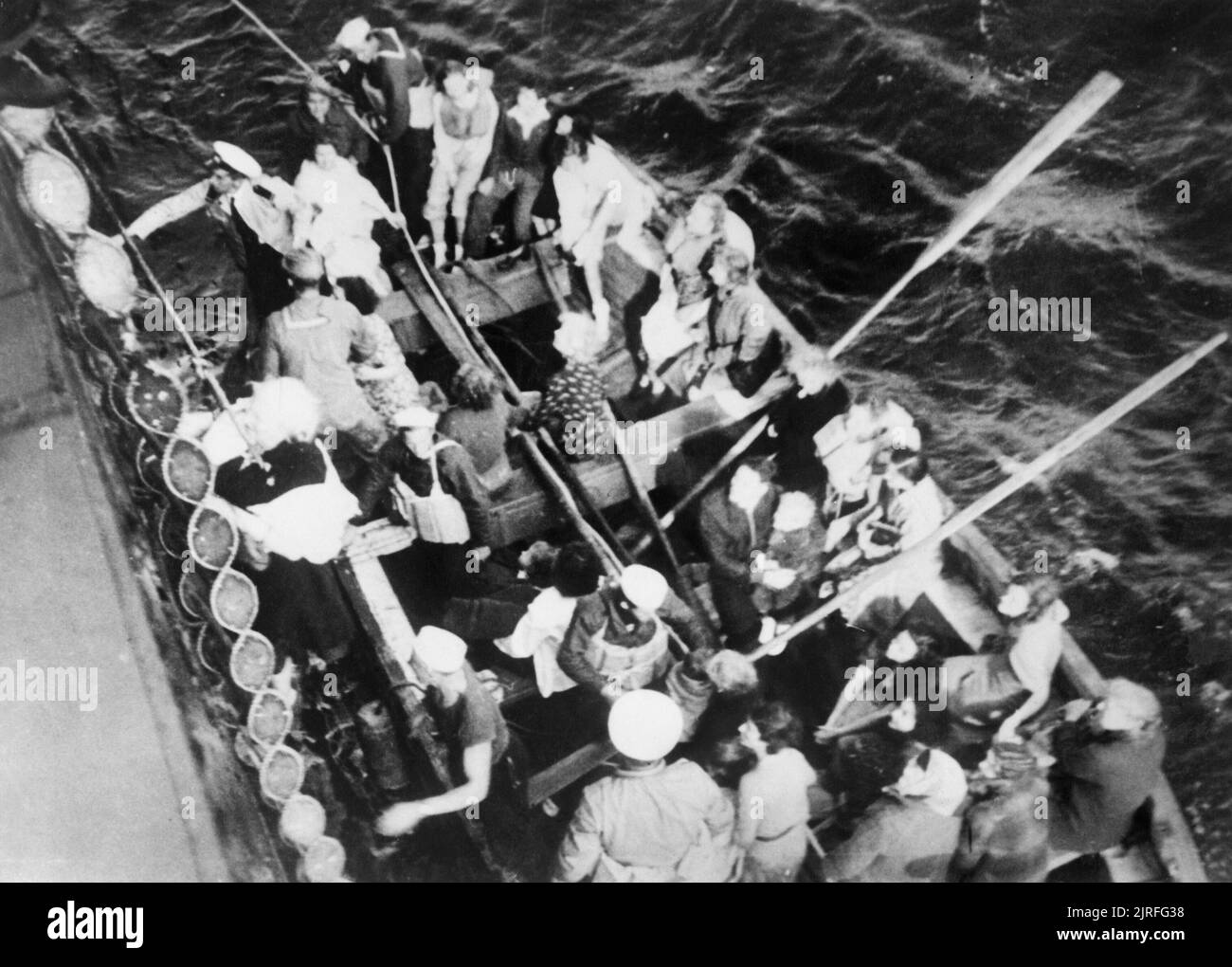 Sinking of SS Athenia, September 1939 An elderly woman is hoisted aboard the American cargo steamship City of Flint after spending the night in a lifeboat. She had been rescued from the passenger liner Athenia which was torpedoed by U-30 on the evening of 3 September 1939 off the north west coast of Ireland and sank the next morning. Stock Photo