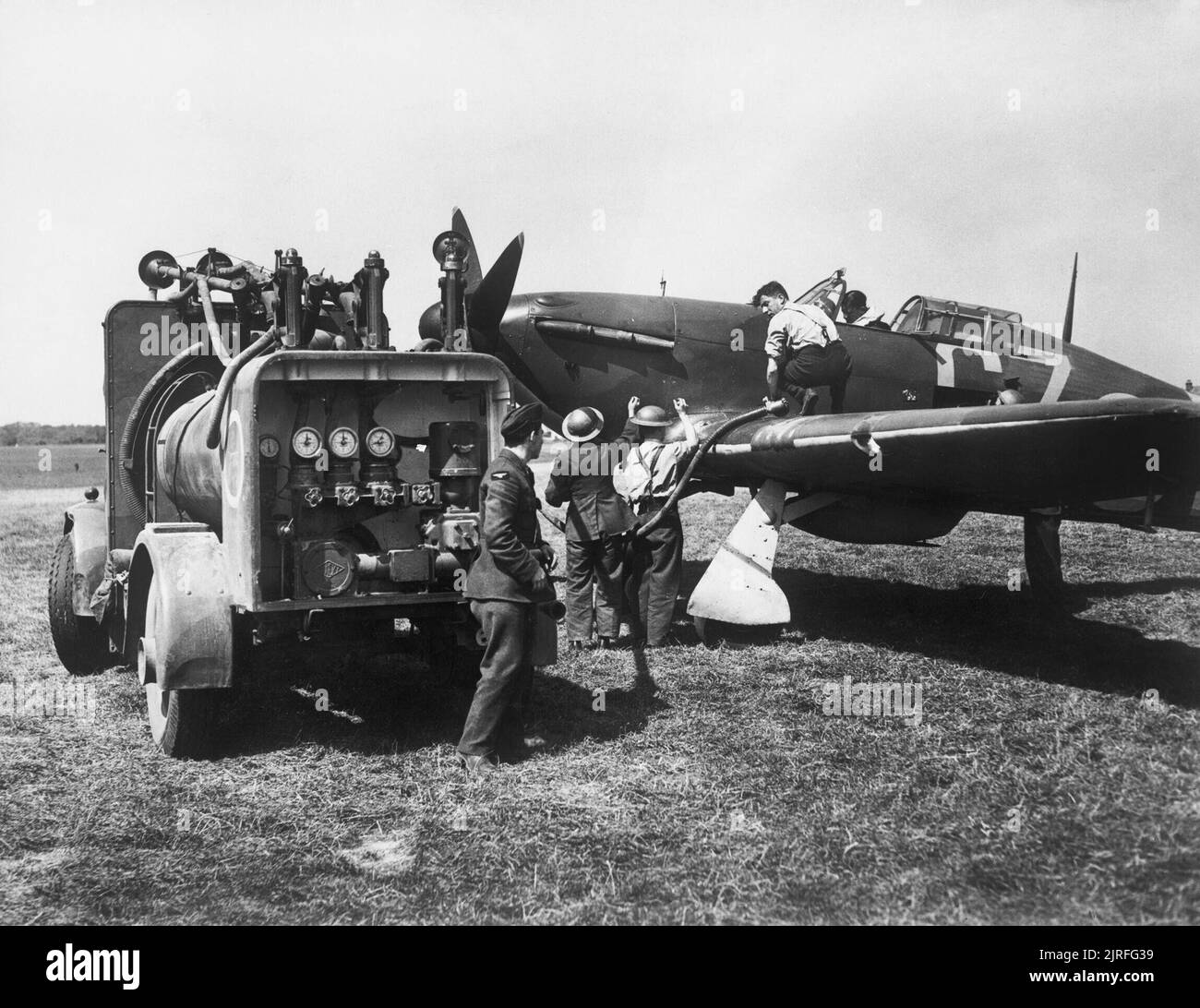 The Battle of Britain Groundcrew refuelling a Hawker Hurricane Mk I of ...