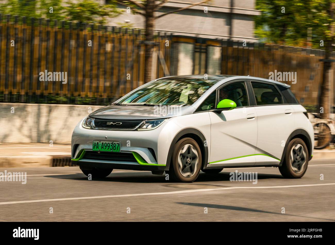 BYD Dolphin small electric hatchback car being driven on the road in