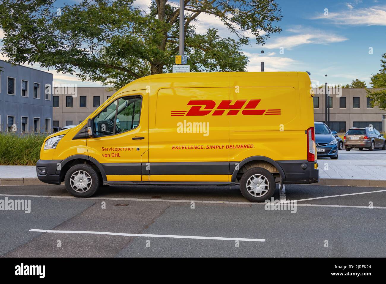 WETZLAR, GERMANY 20211001 DHL Logo on a yellow DHL Truck. DHL is