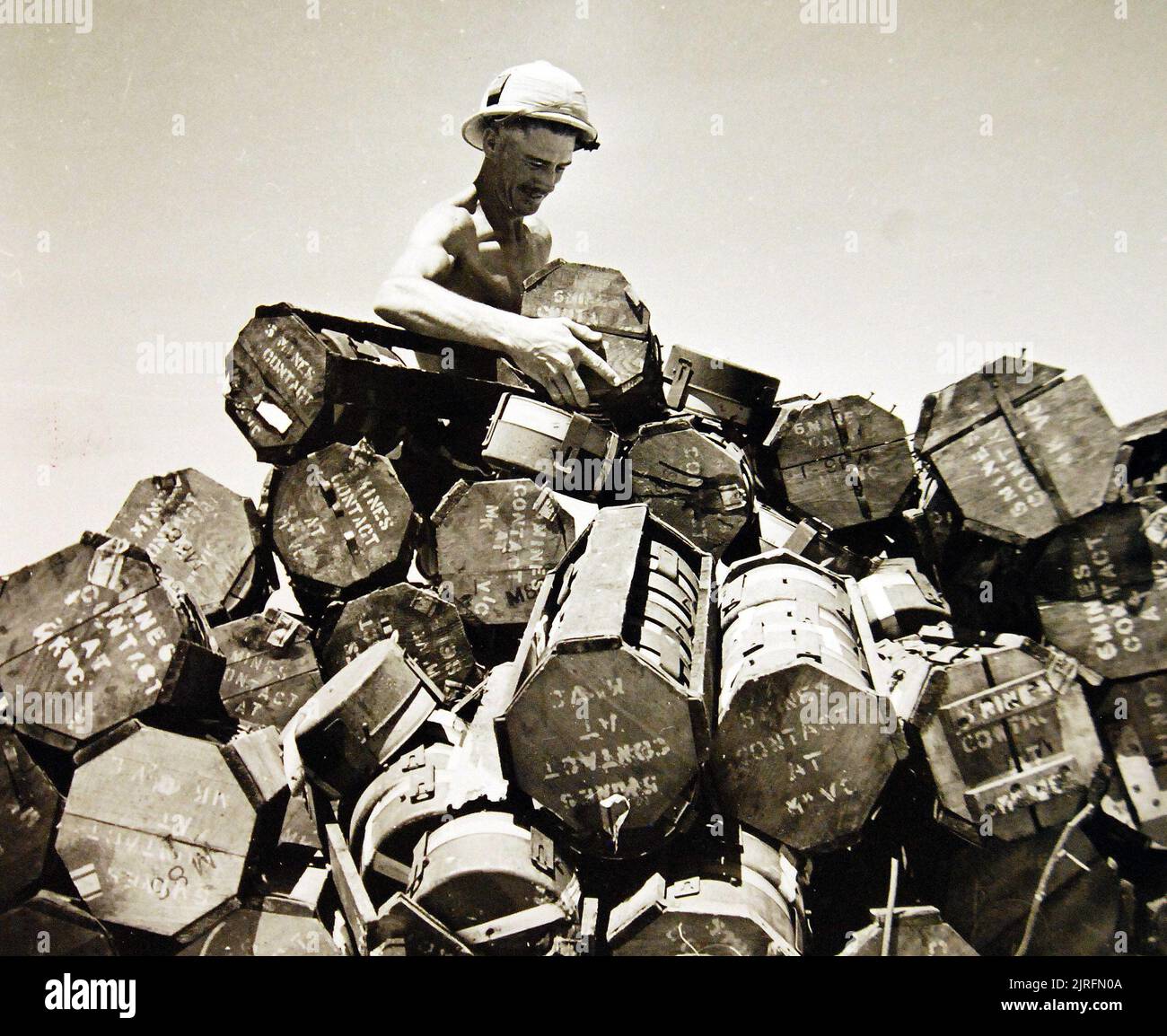 North African Campaign. The laying of mines is playing a big part in the battle and these pictures show South African engineers at work. Shown: Arranging the mines on the central stack. Stock Photo