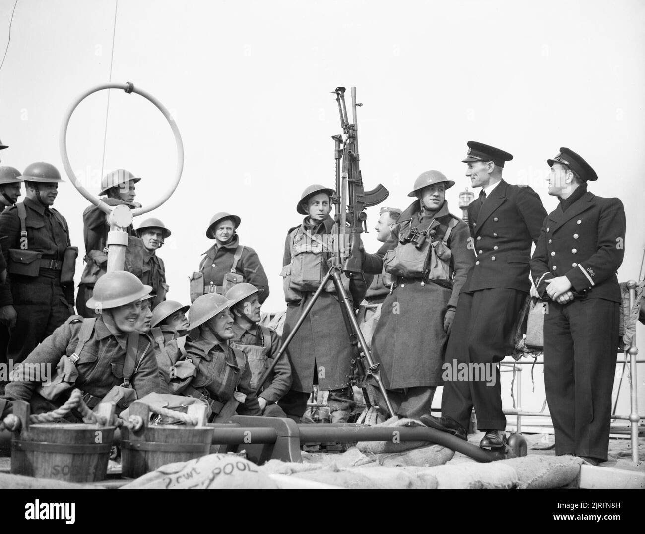 Men of the 1/6th Duke of Wellington's Regiment chat to naval officers on board the Polish steamer SOBIESKI on their way to Norway, 20 April 1940. Men of the 1/6th Duke of Wellington's Regiment (West Riding) chat to officers of the Polish steamer MS Sobieski on board of the ship on their way to Norway. Stock Photo