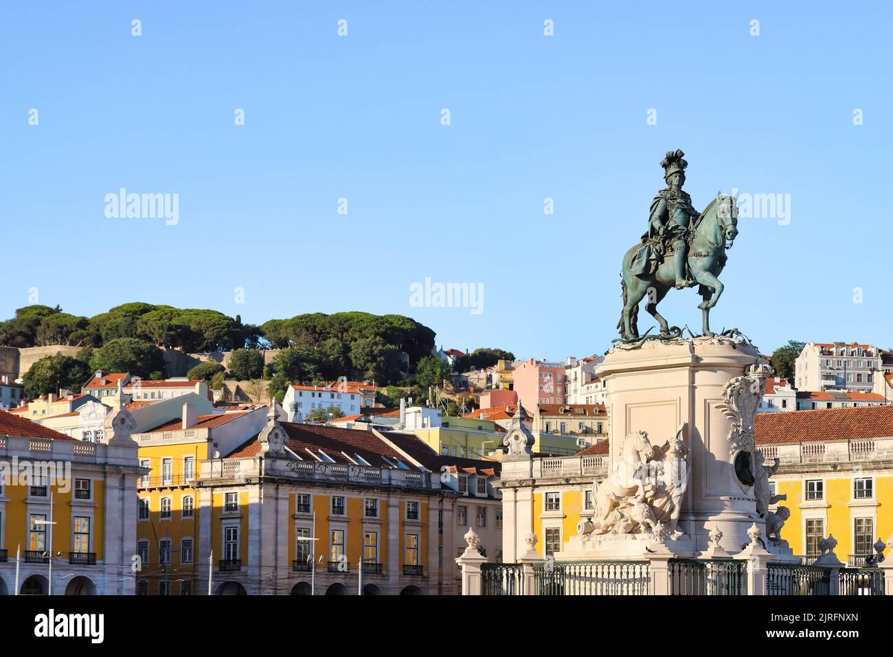 Lisbon, capital city of Portugal. Cityscape as seen from Praça do Comércio, Commerce Plaza with statue of King José I. Copy space, place your text. Stock Photo