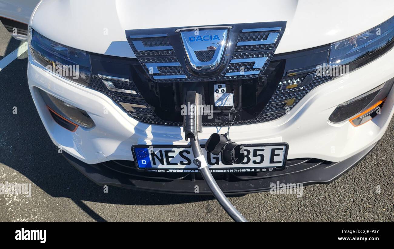 HEILIGENHAUS, NRW, GERMANY - AUGUST 10, 2022: Heiligenhaus, Nrw, Germany - August 10, 2022: Brand new electric Dacia Spring automobile being charged Stock Photo