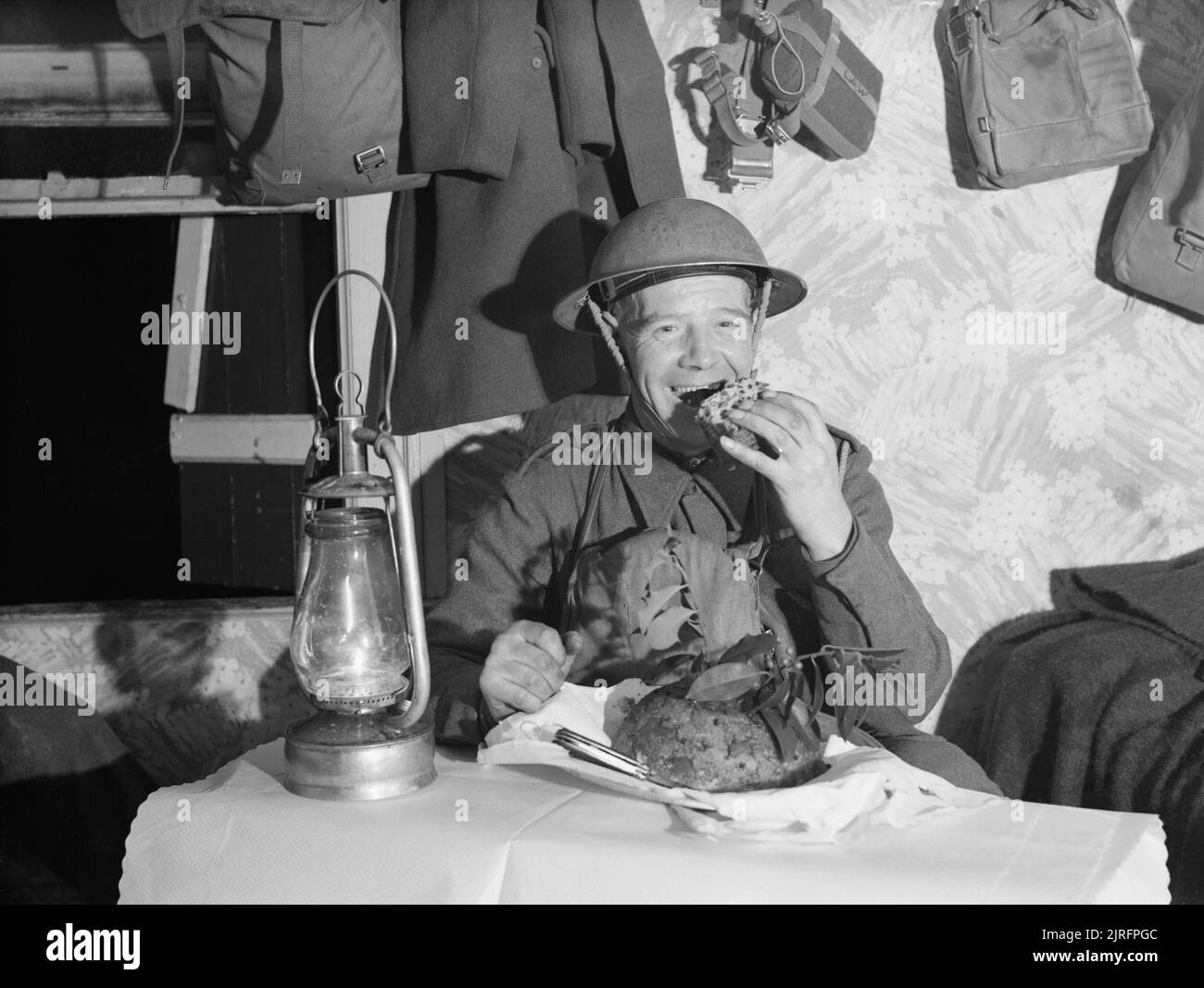 The British Army in France 1939-40 A soldier tucks into his Christmas pudding, December 1939. Stock Photo