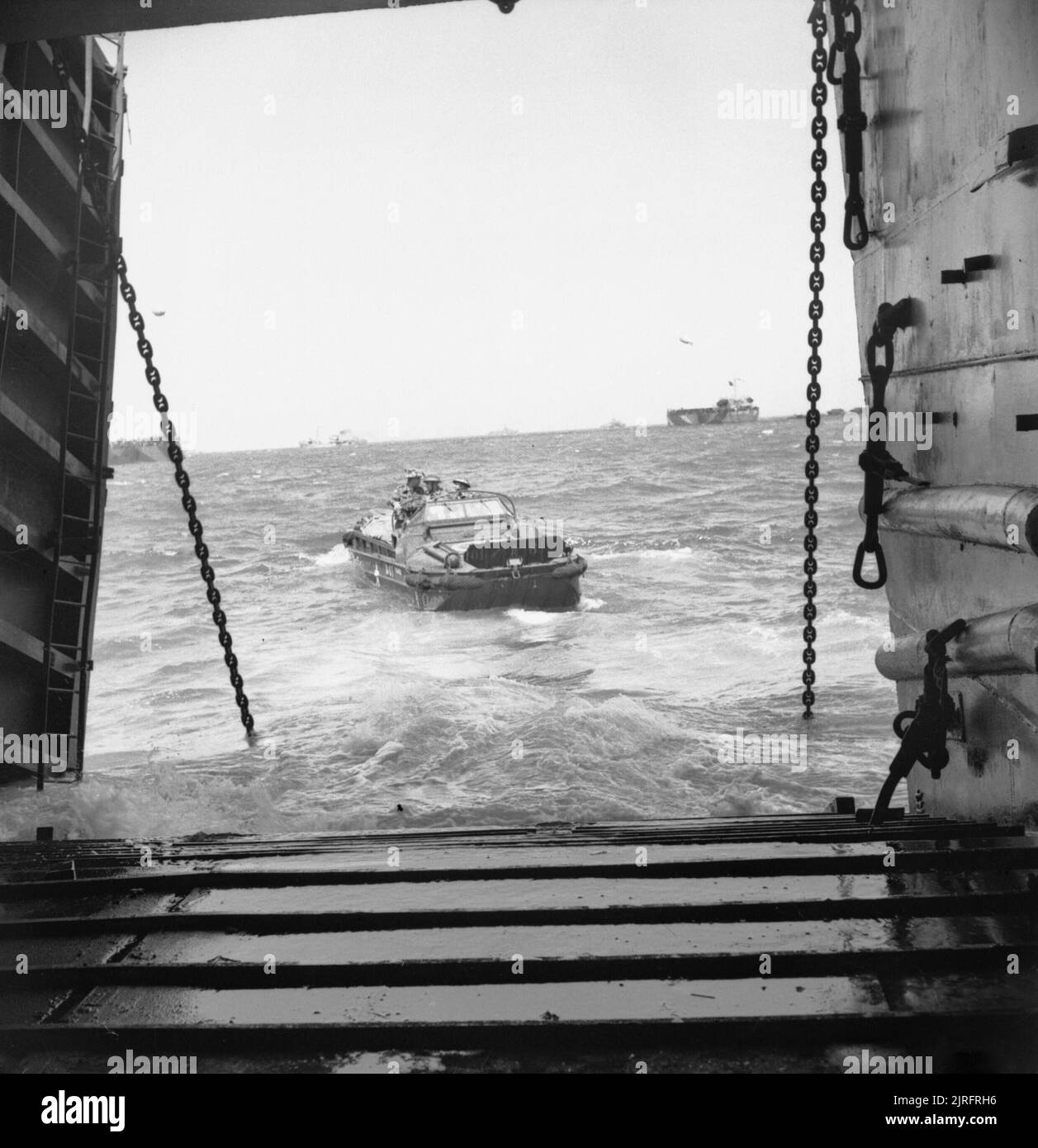 The British Army in Normandy 1944 A DUKW carrying supplies of ammunition leaves a landing ship tank before making its way towards the invasion beaches, 6 June 1944. Stock Photo