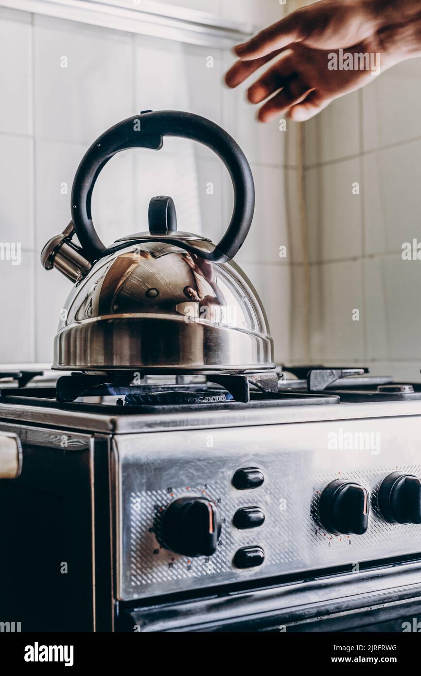 Kettle Boiling On A Gas Stove In The Kitchen. Focus On A Spout
