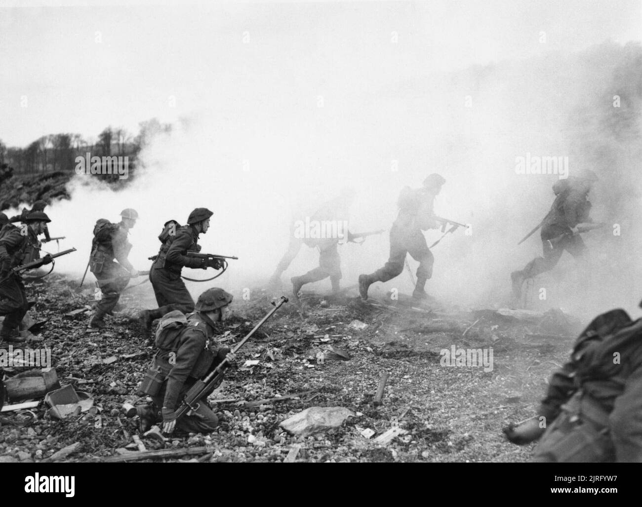 The British Army in the United Kingdom 193945 Commandos dash up a beach under cover of a