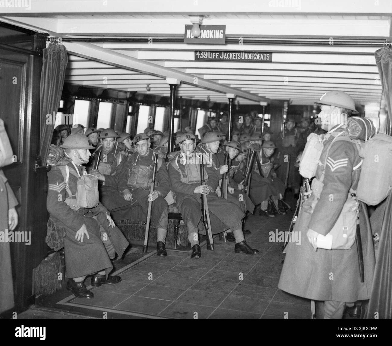 The Royal Navy during the Second World War Troops being transported from one troop transport to another in a tender off the Norwegian coast, shortly after the first allied contingents began landing in Norway to counter the German invasion. The men are part of 61st Division. Stock Photo