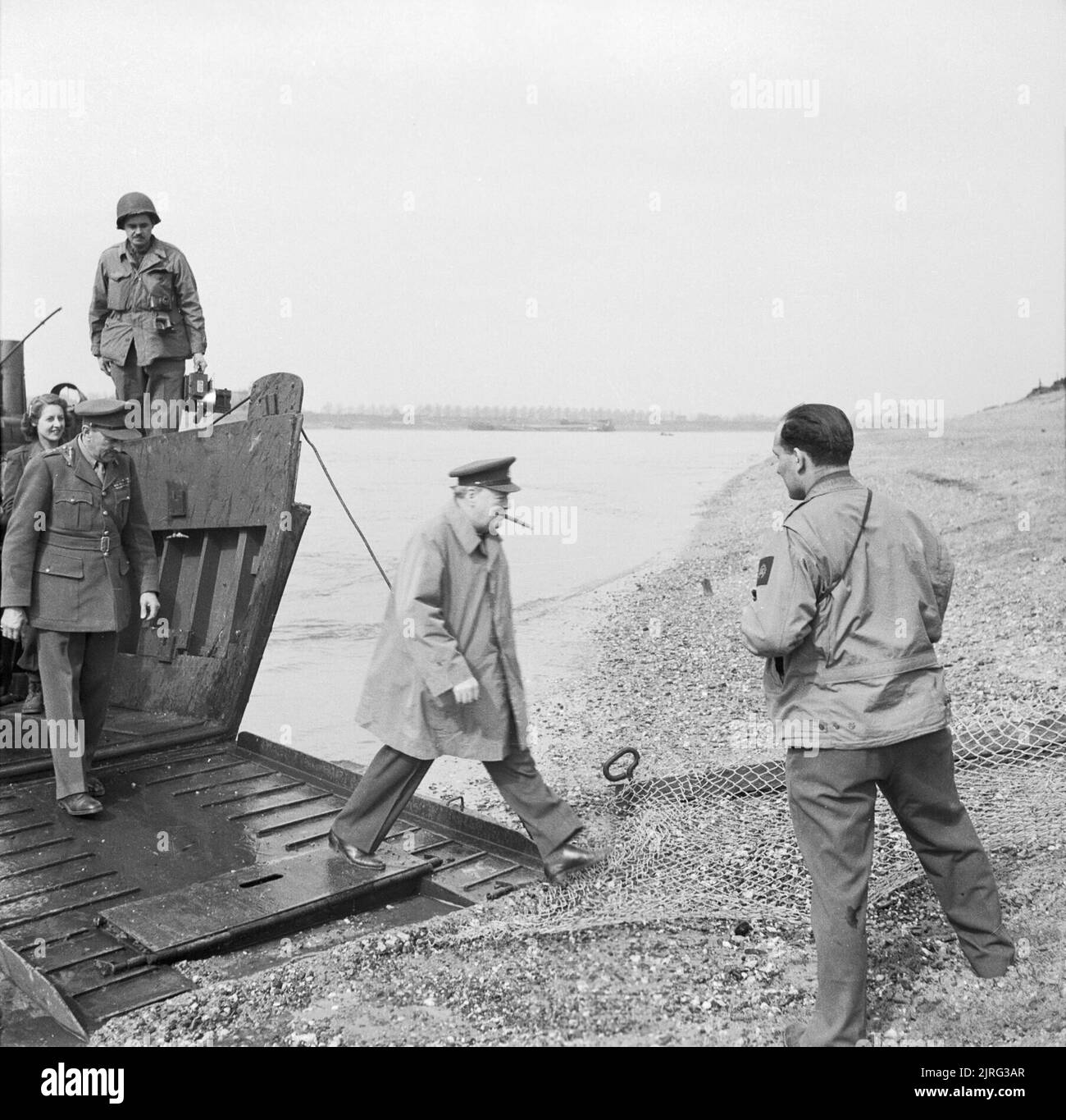 Winston Churchill steps ashore from an American assault landing craft