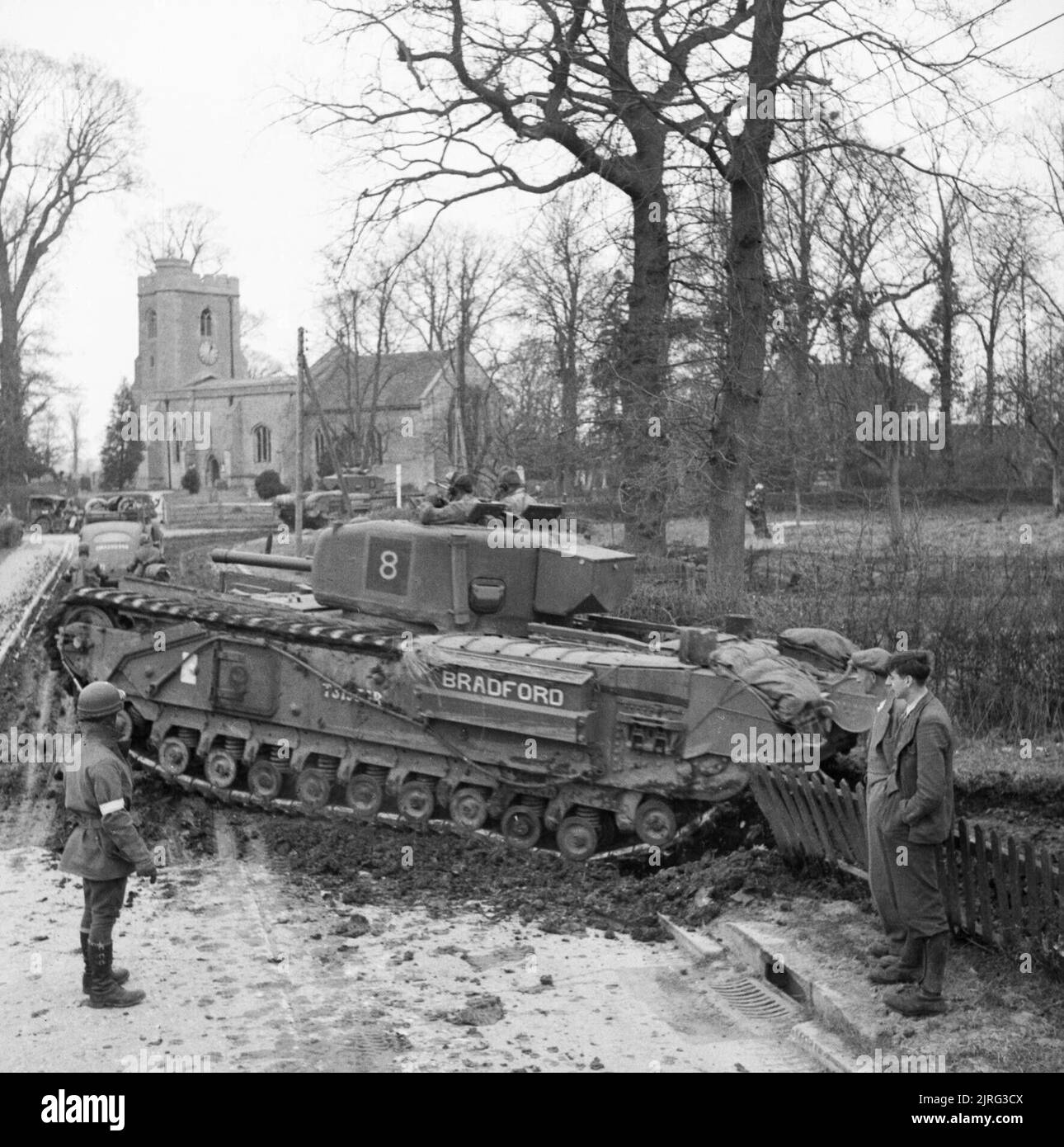 Churchill IV tank enters an English village during Exercise 'Spartan ...