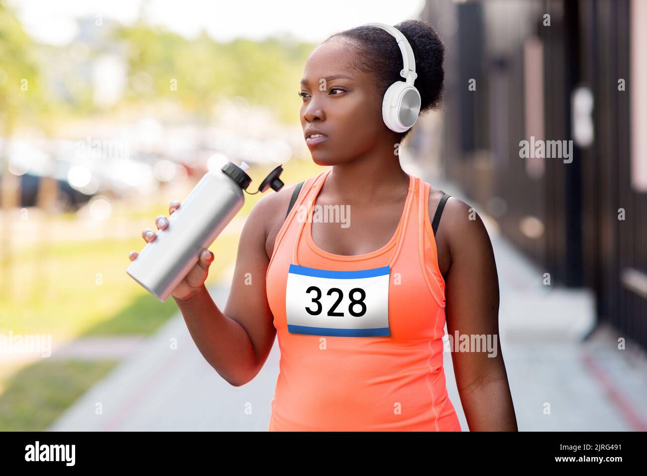 african female marathon runner drinking water Stock Photo Alamy