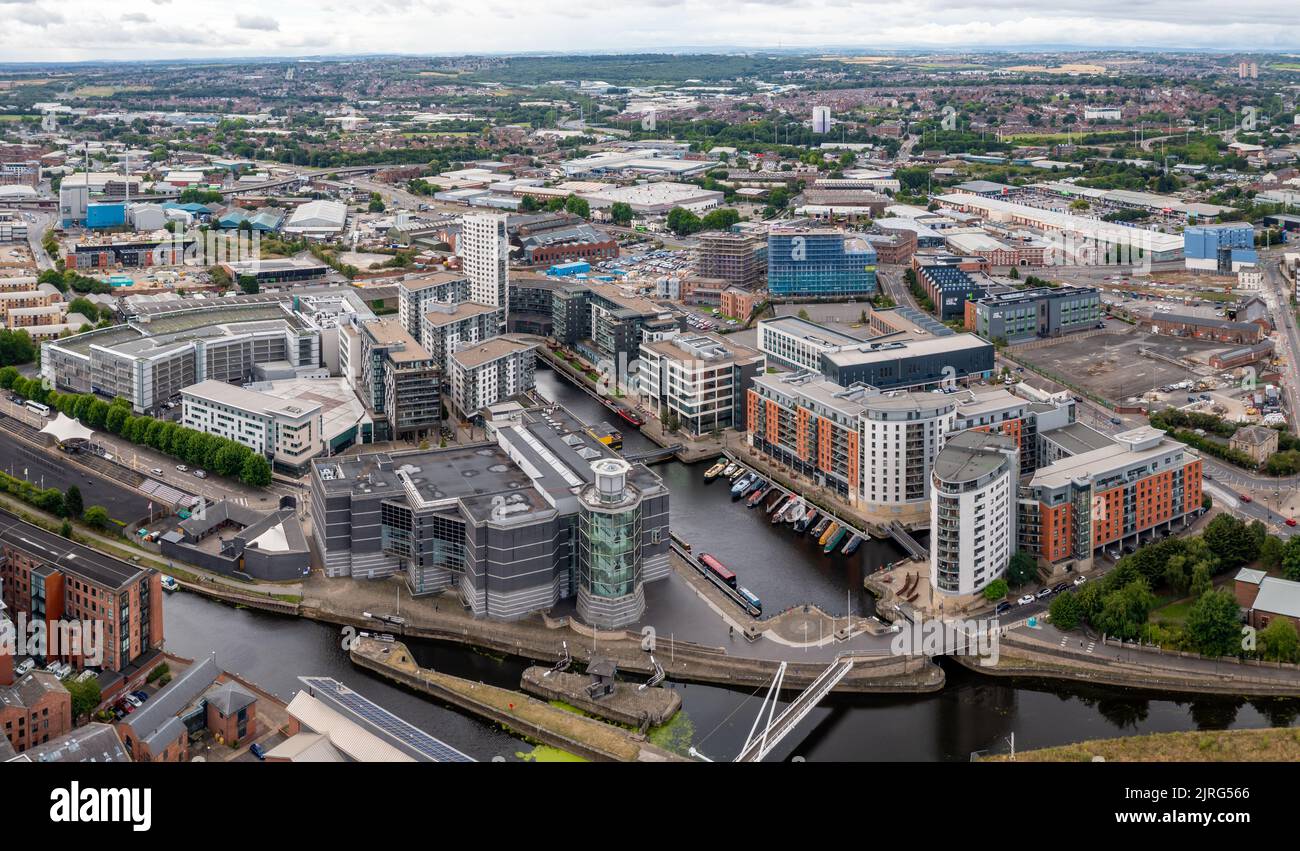 LEEDS, UK - AUGUST 24, 2022.  Aerial view of Leeds Dock area with access to the Leeds to Liverpool canal and luxury waterfront apartments Stock Photo