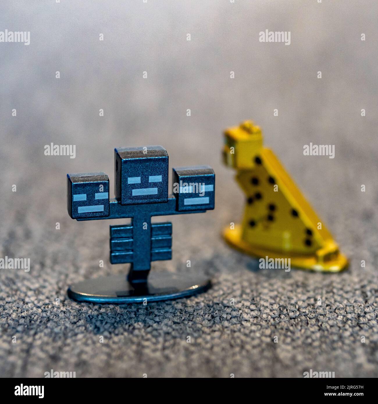 A closeup shot of a Minecraft Wither monster toy figurine made of metal Stock Photo