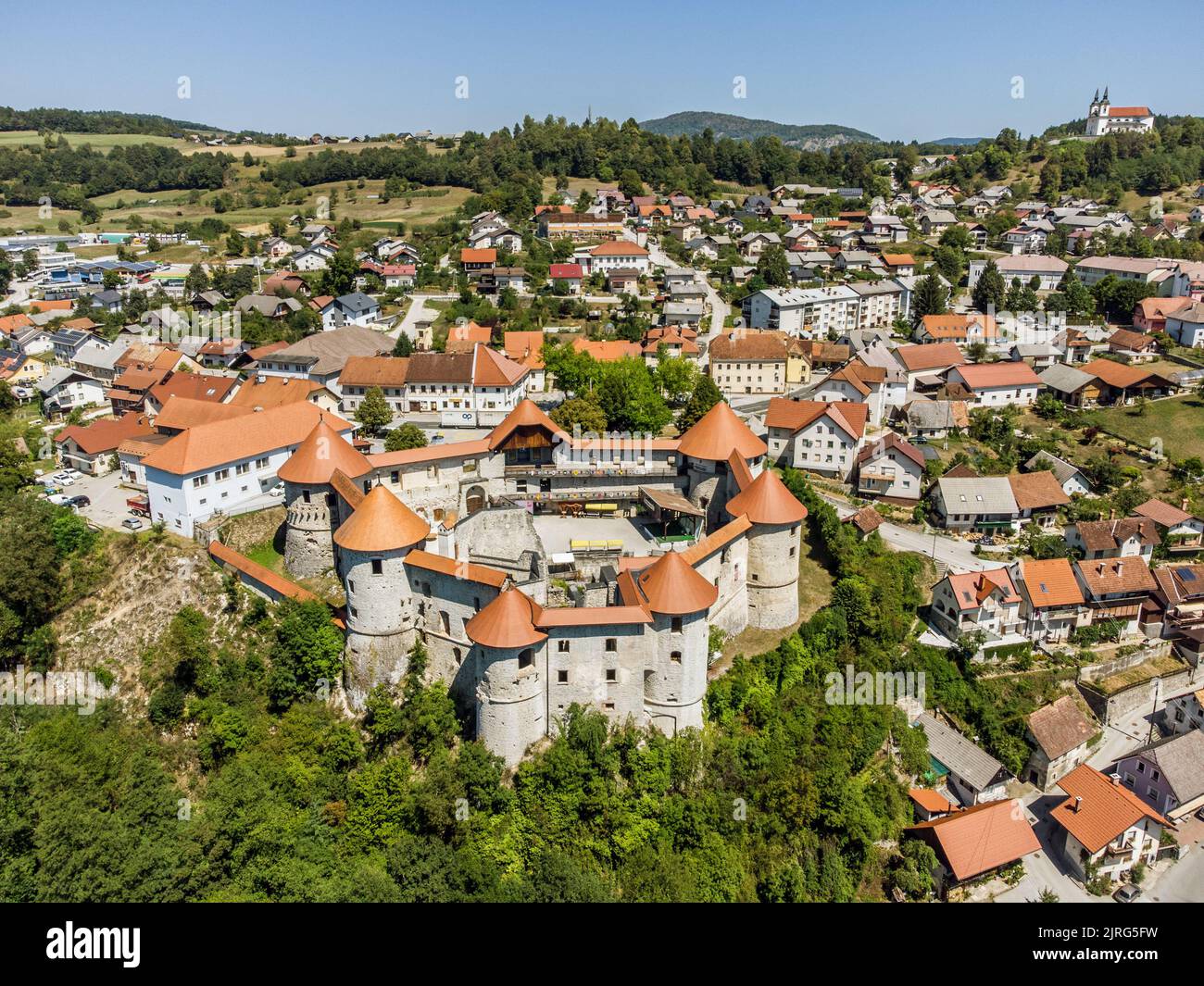 Aerial drone view of Medieval castle of Zuzemberk or Seisenburg or Sosenberch, positioned on terrace above the Krka River Canyon, Central Slovenia. Stock Photo