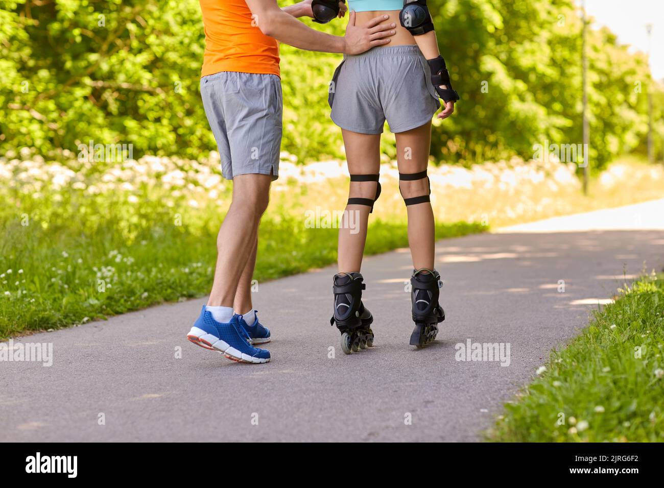 Person Riding Roler Skates Rear view couple riding roller hi-res stock photography and images - Alamy