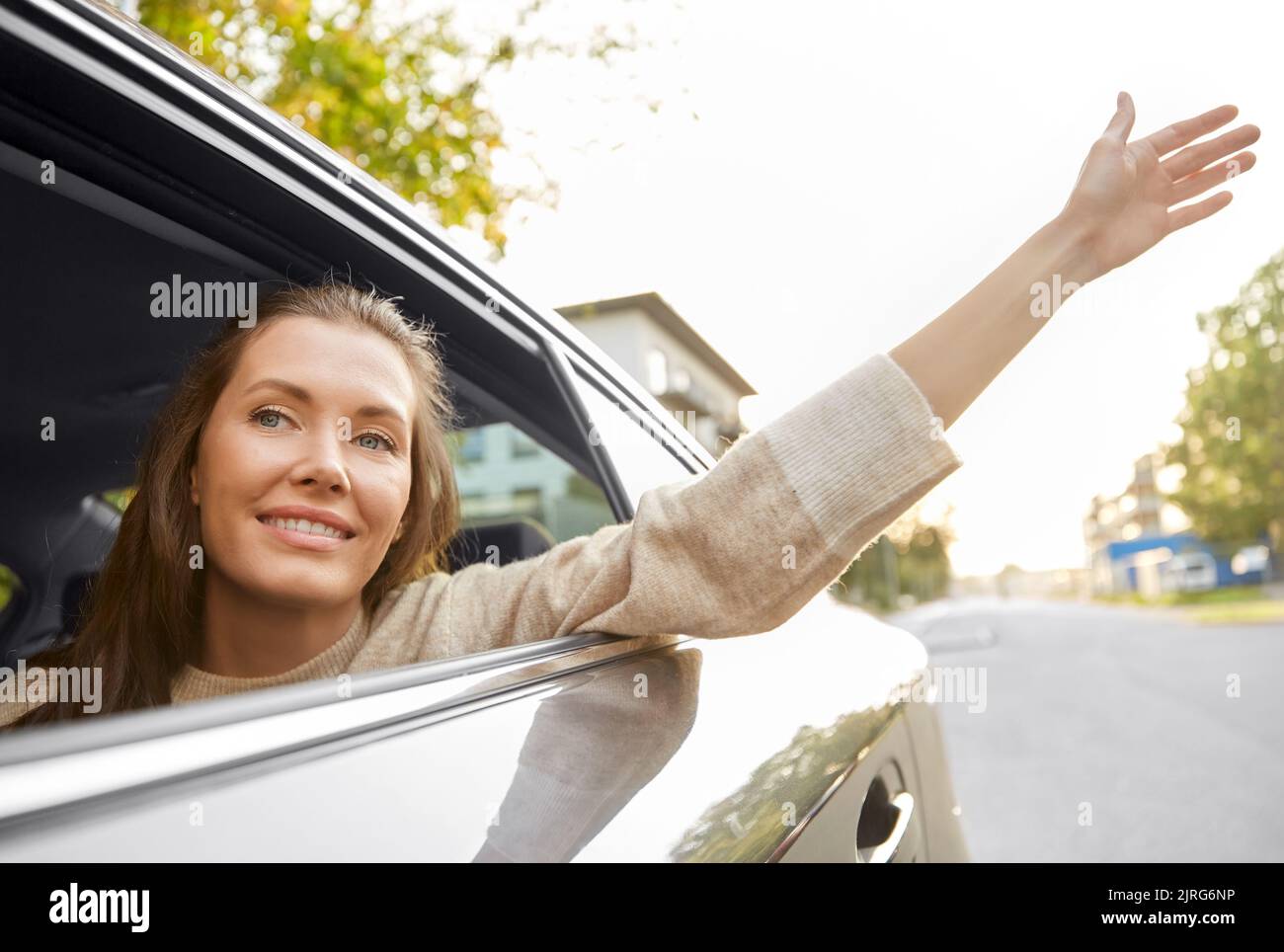 happy smiling woman or female passenger in car Stock Photo - Alamy