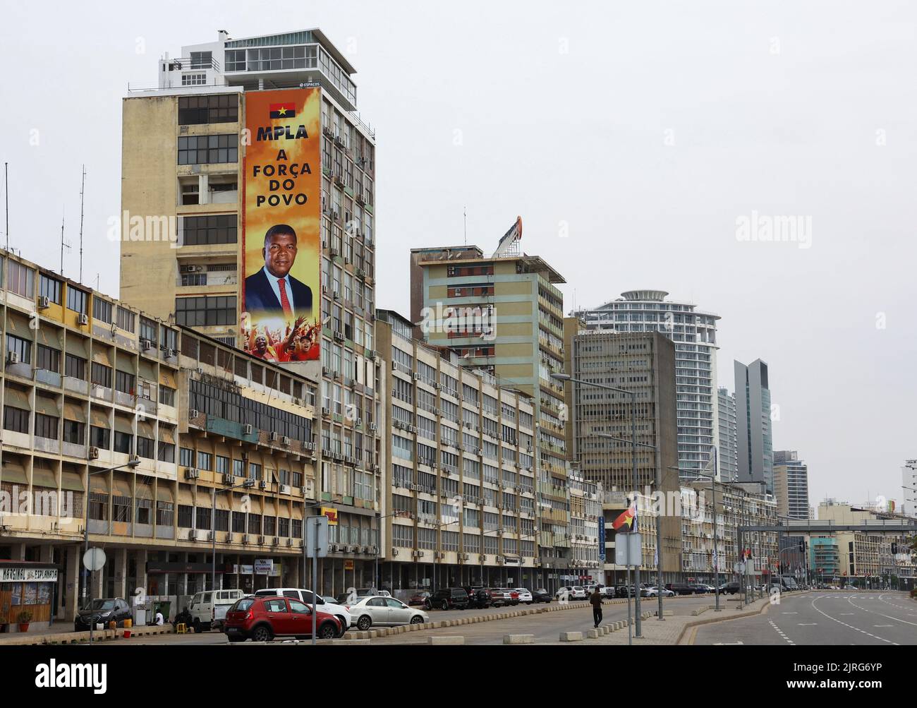 A billboard with the face of Angola's President and leader of the People's Movement for the Liberation of Angola (MPLA) ruling party Joao Lourenco is seen on dilapidated buildings during the general election in the capital Luanda, Angola August 24, 2022. REUTERS/Siphiwe Sibeko Stock Photo