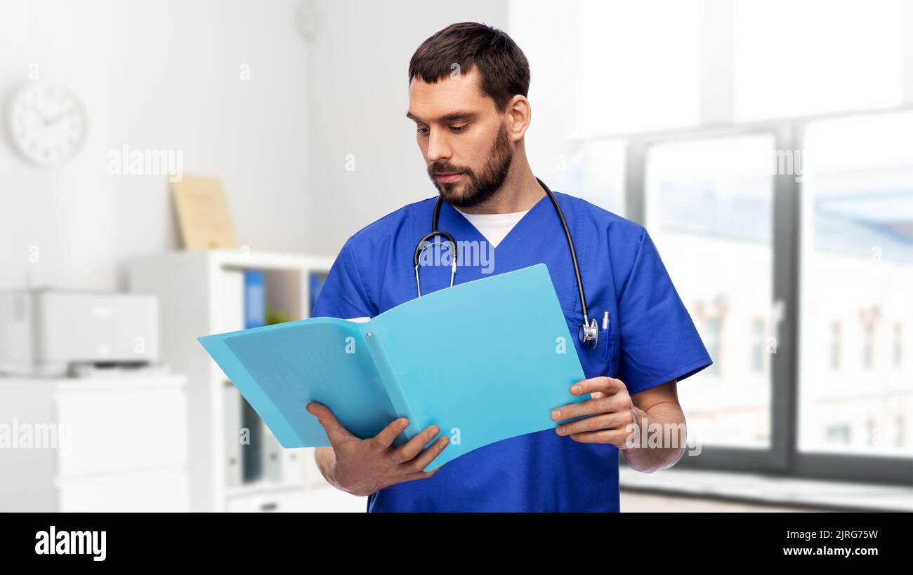 Nurse doctor looking in folder hi-res stock photography and images - Alamy