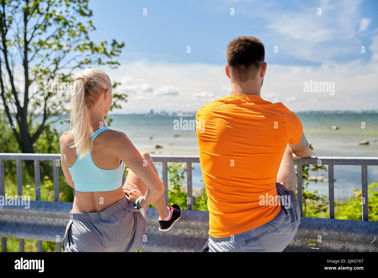 Young sporty man stretching hi-res stock photography and images - Alamy