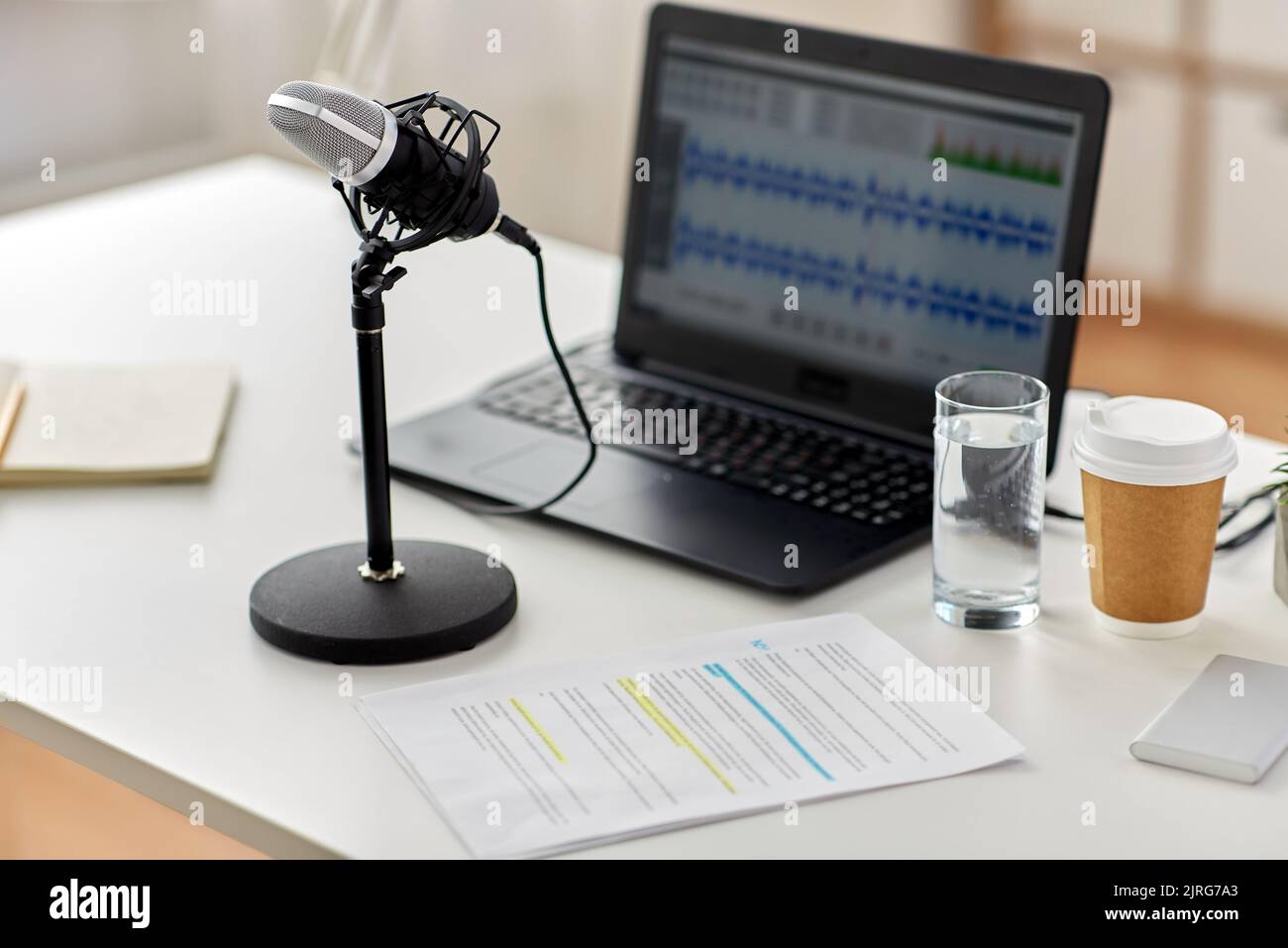 microphone and sound editor on laptop at office Stock Photo Alamy