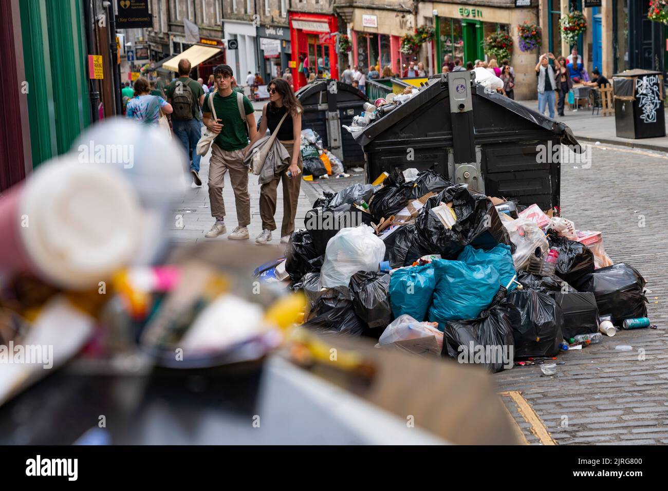 Edinburgh, Scotland, UK. 24th August 2022. Rubbish is seen piled on the streets of Edinburgh city centre on day seven of a 12 day strike by city refuse collectors.  Iain Masterton/Alamy Live News Stock Photo