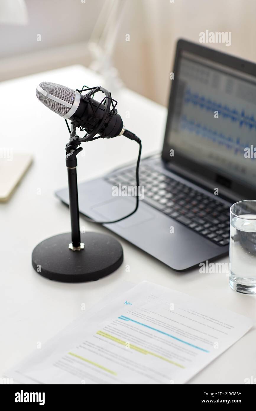 microphone and sound editor on laptop at office Stock Photo Alamy
