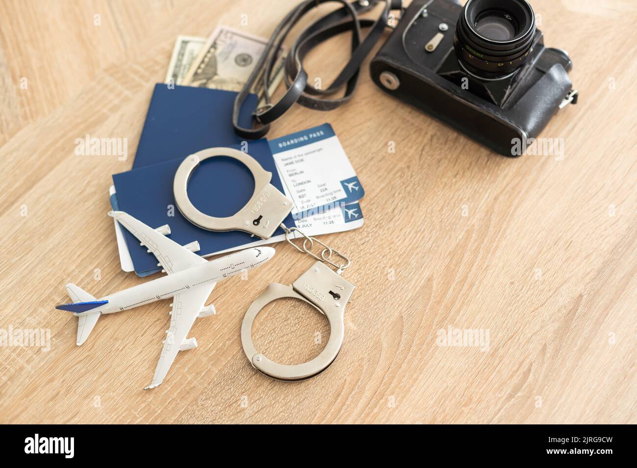 passport, tickets, toy plane, handcuffs for travel Stock Photo Alamy