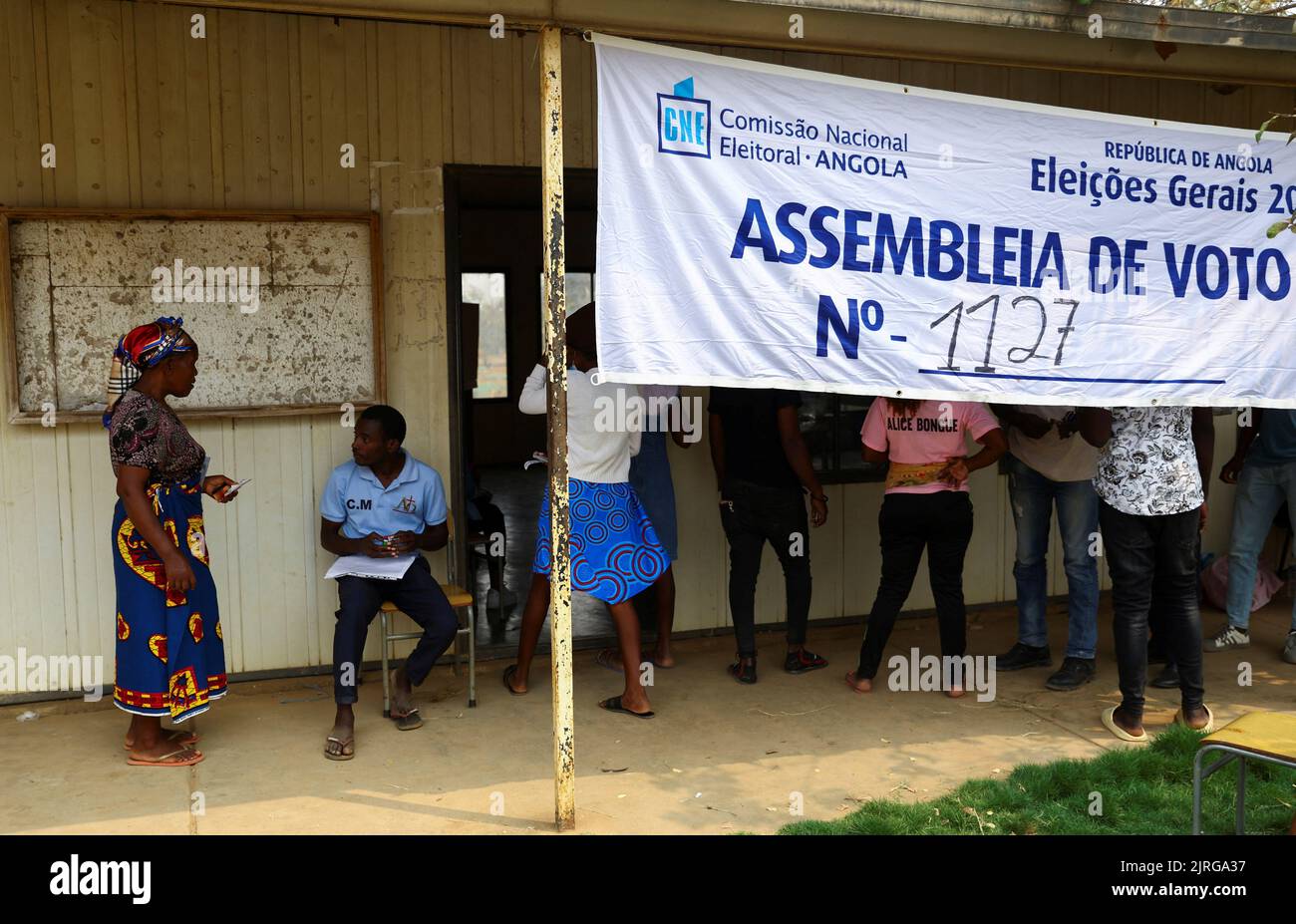 A woman arrives at a voting station before casting her vote during the general election in Cacuaco, a suburb of the capital, Luanda, Angola August 24, 2022. REUTERS/Siphiwe Sibeko Stock Photo