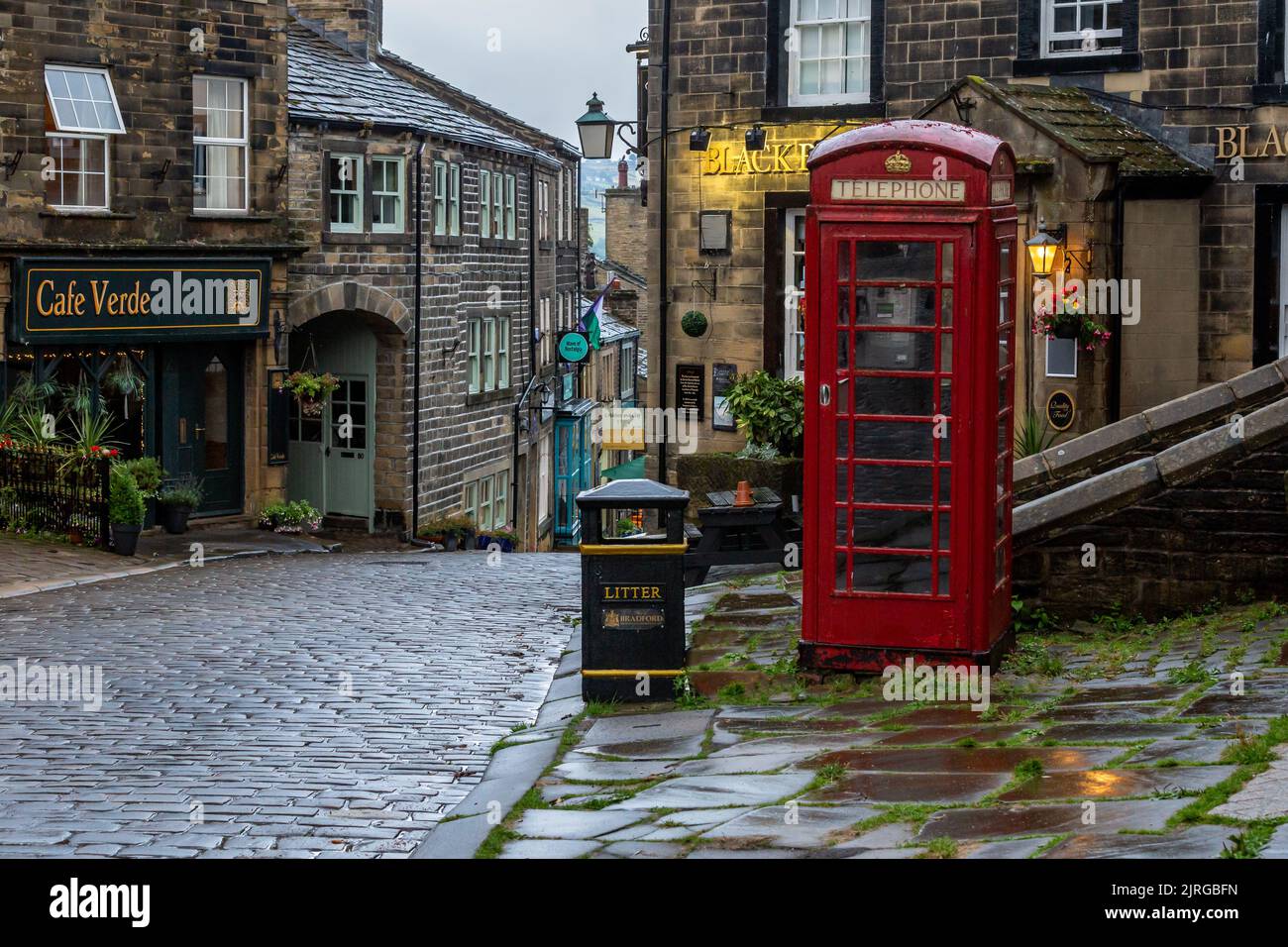 The top of Main Street, Haworth, Yorkshire. Haworth was the home of the Bronte sisters and is a well known tourist destination. Stock Photo