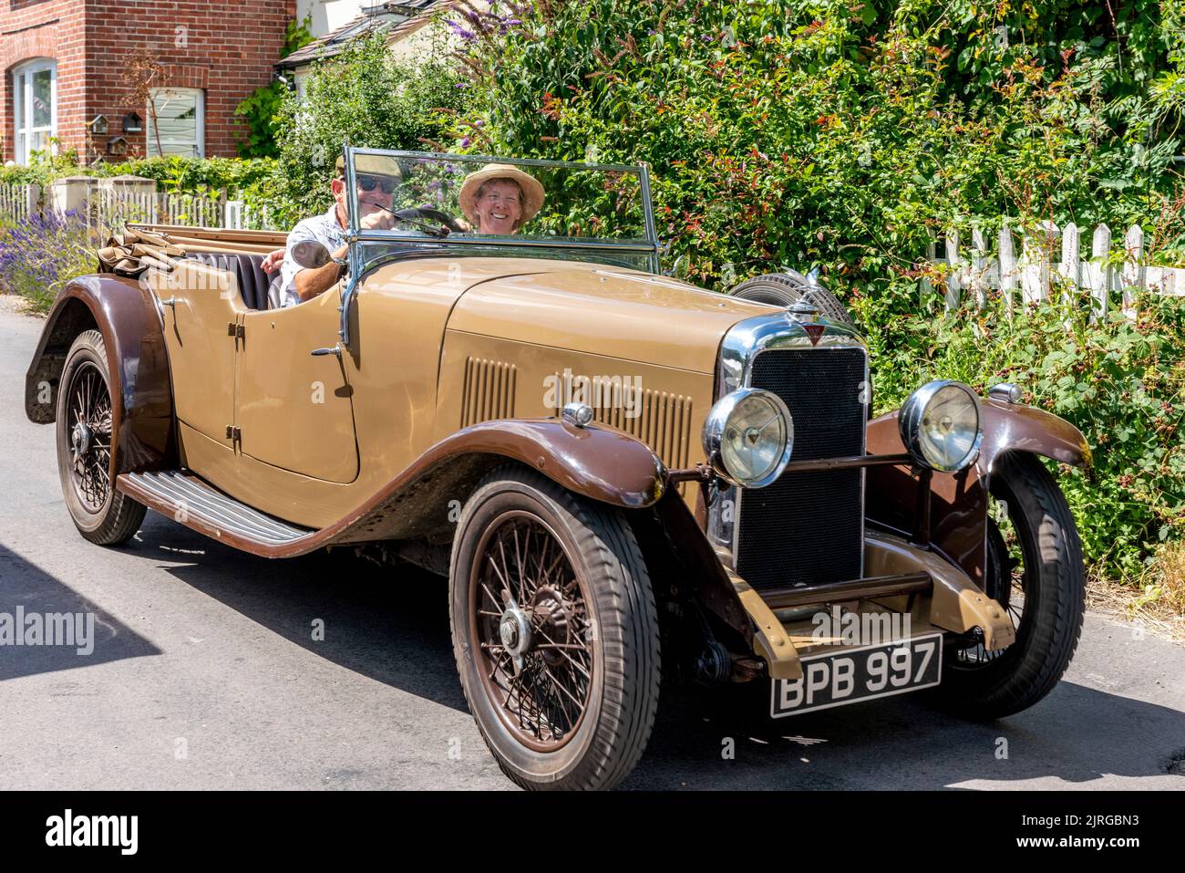 A Middle Aged Couple In A Vintage Car, Fairwarp Village, East Sussex, UK. Stock Photo