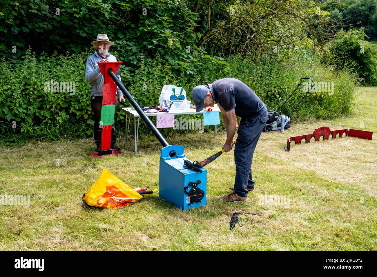 A Local Man Plays The Traditional Game Of Splat The Rat At The Annual Poynings Fete, Poynings, East Sussex, UK. Stock Photo