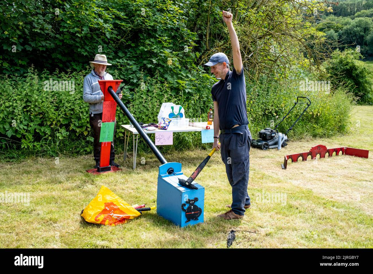 A Local Man Plays The Traditional Game Of Splat The Rat At The Annual Poynings Fete, Poynings, East Sussex, UK. Stock Photo