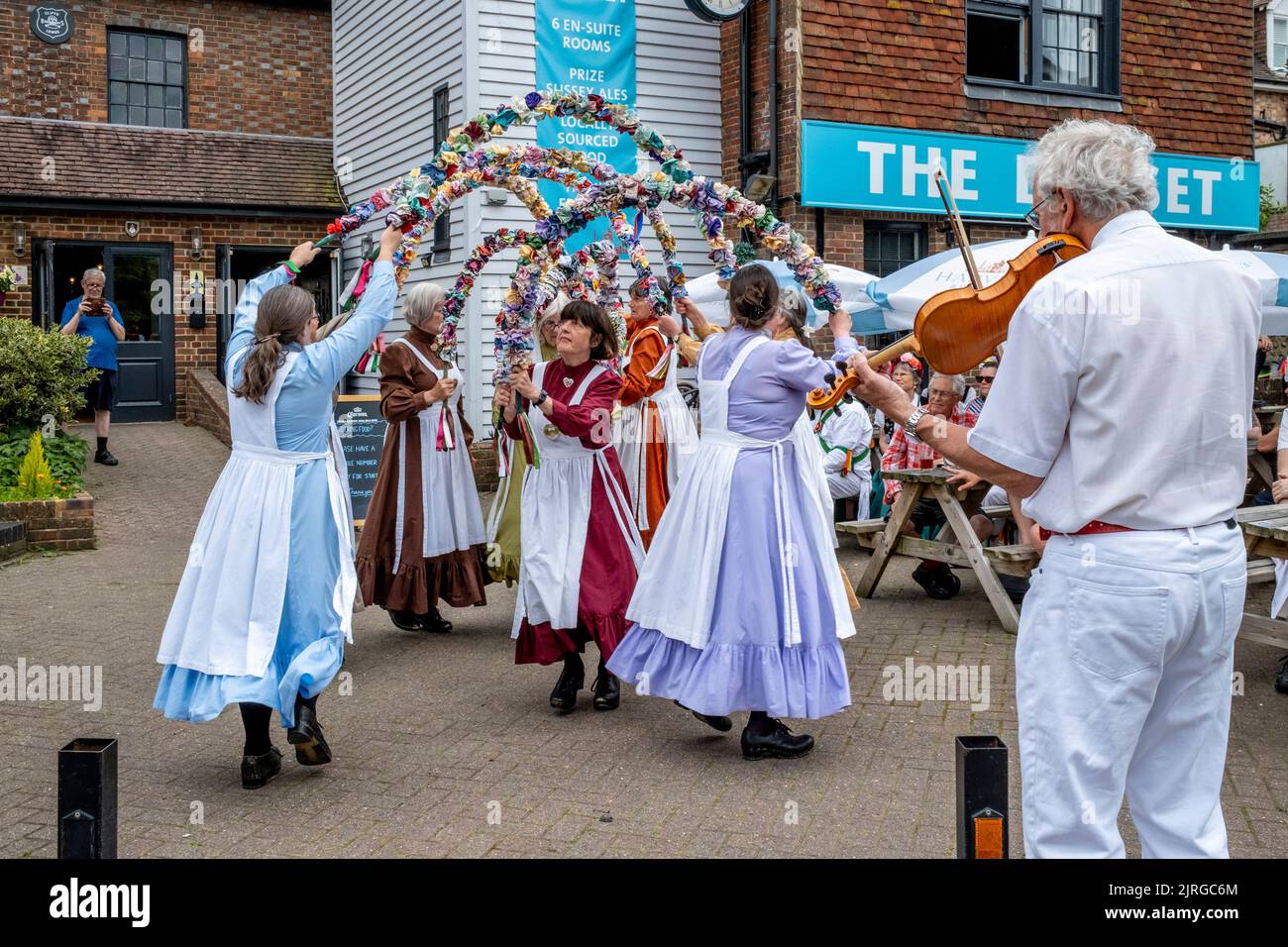 The Knots Of May Female Morris Dancers Perform Outside The Dorset Pub In Lewes, East Sussex, UK. Stock Photo