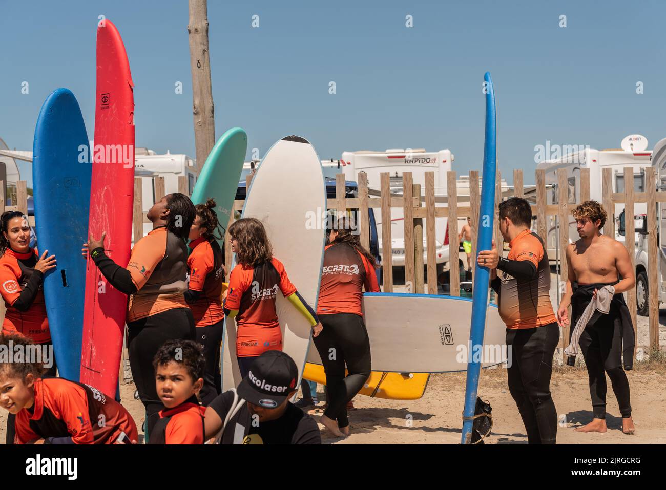 Aveiro, Portugal August 19, 2022 people with wetsuits and pick up