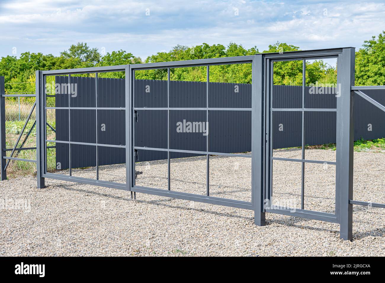 Installation of metal gates Stock Photo Alamy