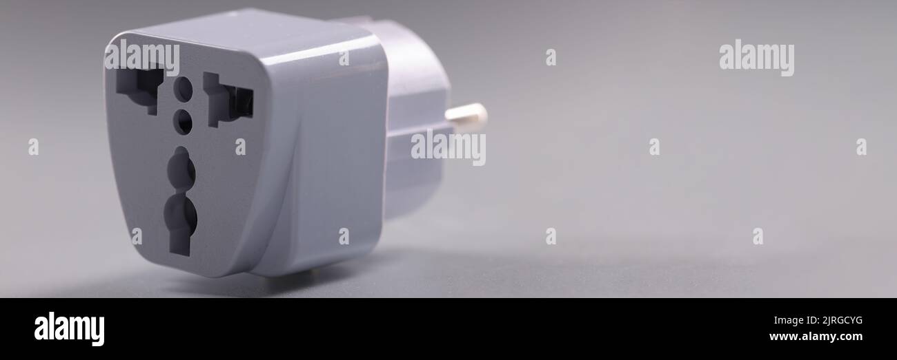 Universal white plugs adapter, adapter to put in sockets Stock Photo Alamy