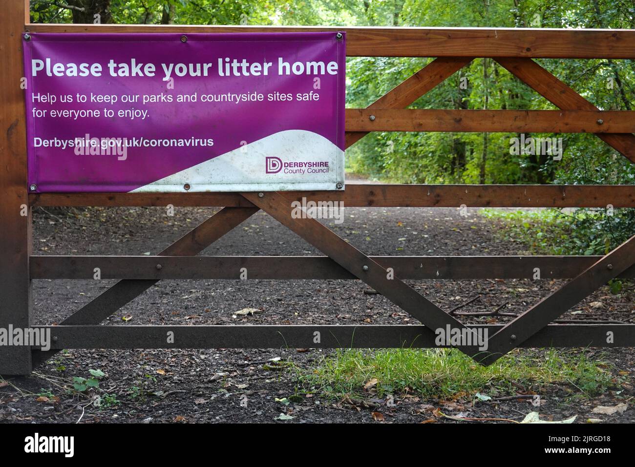 A notice at the start of the Sett Valley Trail in Hayfield, Derbyshire asking people to take their litter home. Stock Photo
