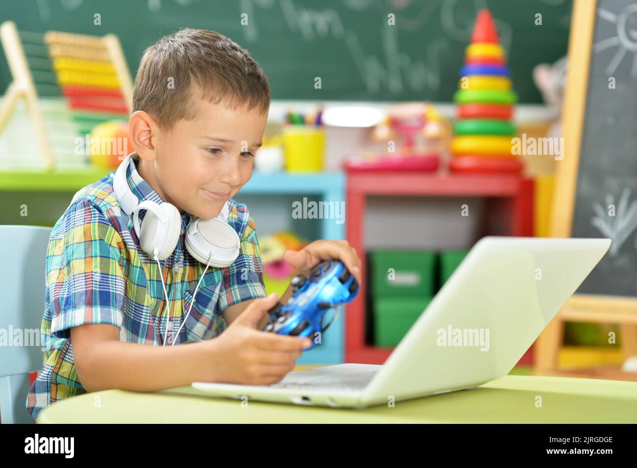 little boy using laptop Stock Photo - Alamy