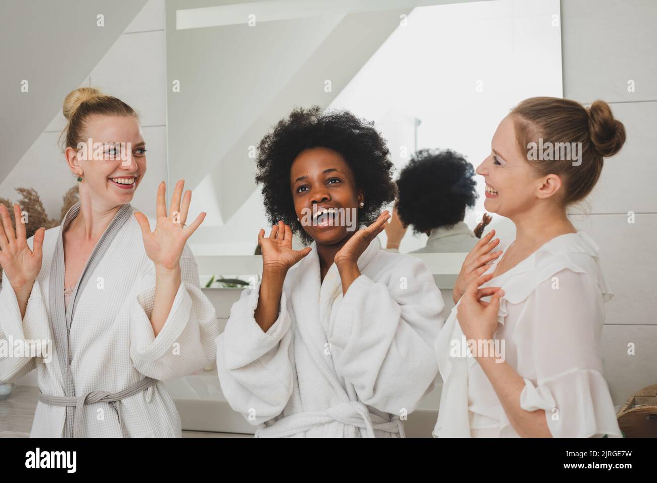 The young women delighted with the spa day Stock Photo