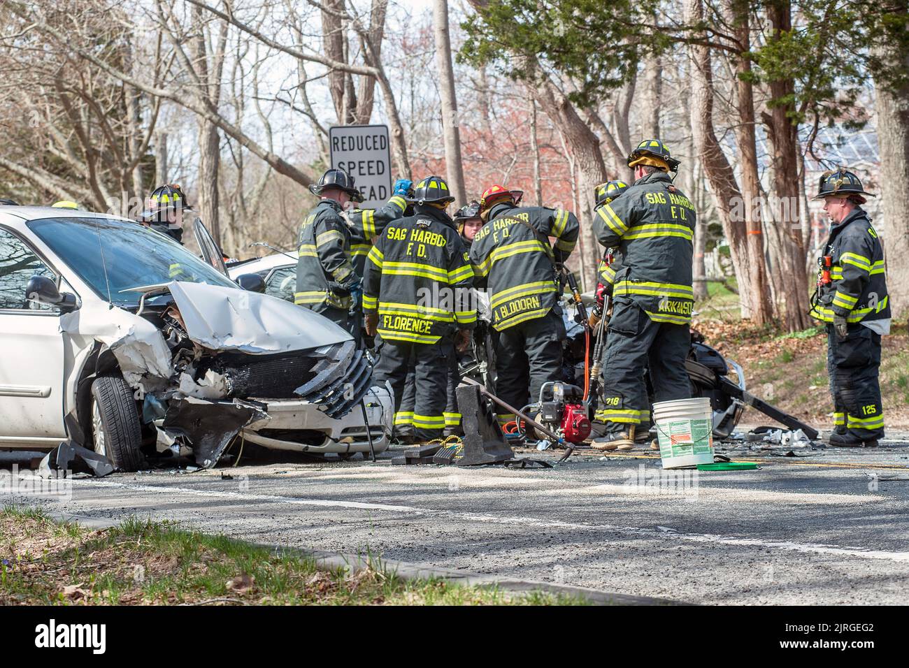 Members of the Sag Harbor Ambulance and Fire Department Heavy Rescue Squad work to extricate and care for the victims of a three-car motor vehicle acc Stock Photo