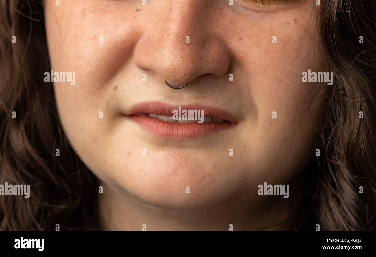 Close Up of young woman turning up her nose Stock Photo