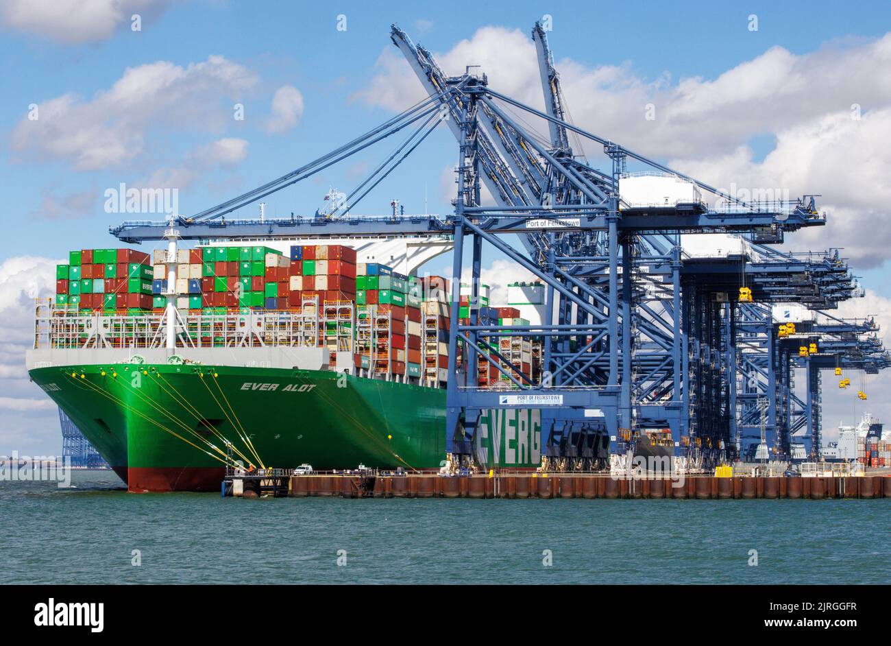 Felixstowe, UK 24 Aug 2022 The Ever Alot is berthed at the Felixstowe docks. It is the largest container ship in the world. The dockers are on strike over pay issues so the containers cannot be unloaded until the issue is resolved. Hudong-Zhonghua Shipbuilding Group Co. (Hudong-Zhonghua), a subsidiary of China State Shipbuilding Corporation (CSSC), built and delivered the world's largest containership to Taiwanese shipping company Evergreen Marine. The Ever Alot vessel has a carrying capacity of 24,004 TEU and measures 400 metres long by 61.5 metres wide, with a draft of 17 metres. The giant Stock Photo